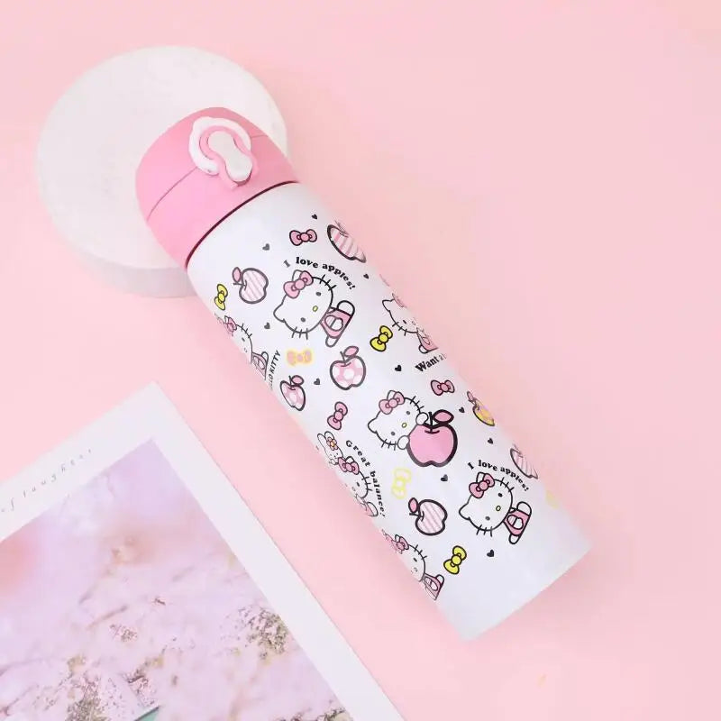 Hello Kitty-themed water bottle on a pink background