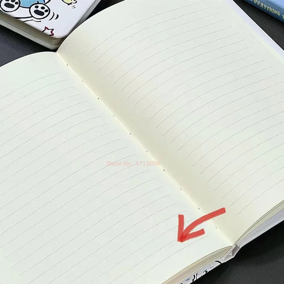 Open notebook with lined pages on a dark surface, showing text and an arrow.