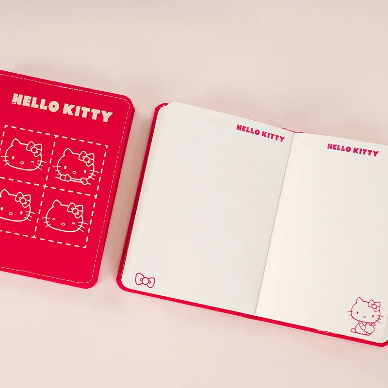 Red 'Hello Kitty' notebook and cover on a pink background