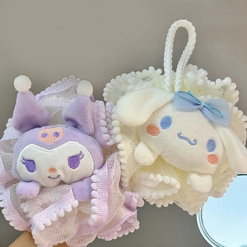 Two cute kitty bath sponge plush toys on a decorative mesh background
