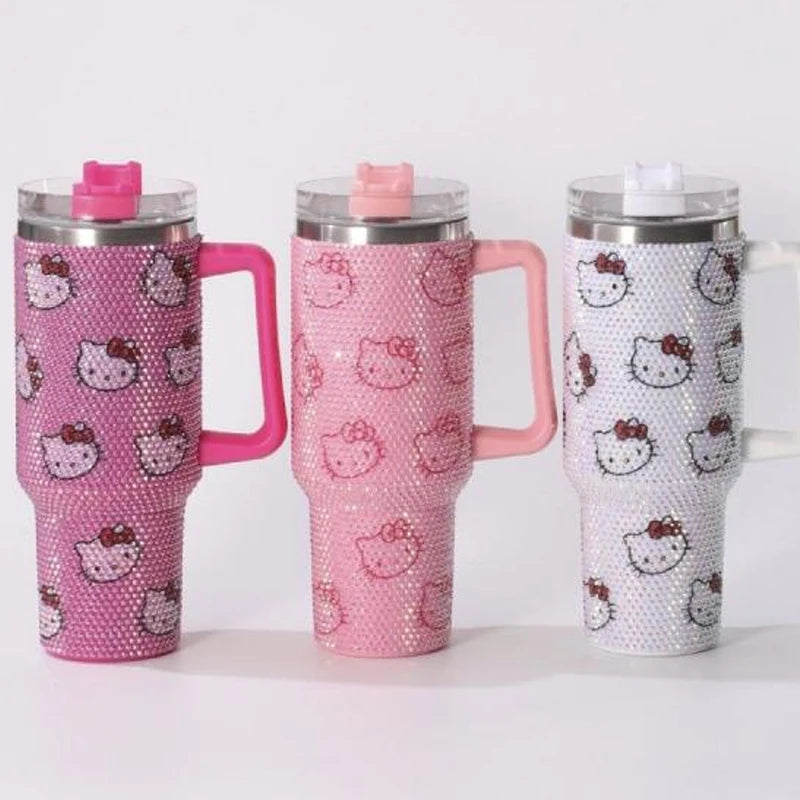 Three pink and white tumblers with Hello Kitty designs on a white background