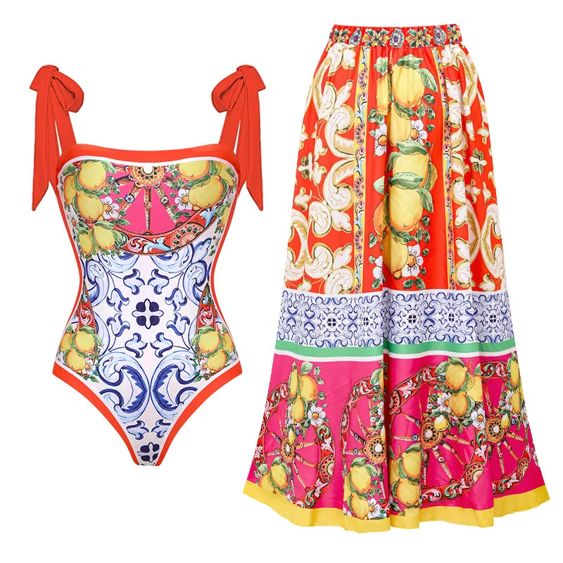 Colorful swimsuit and skirt with floral and lemon pattern on a white background