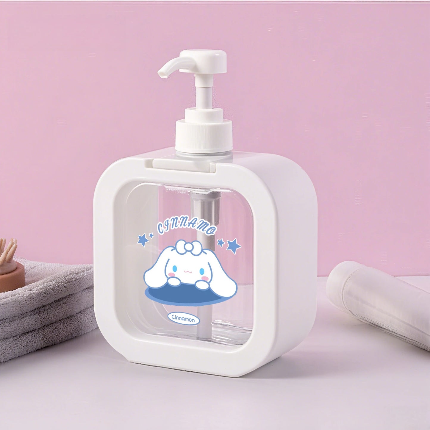 White soap dispenser with cartoon character on a pink background