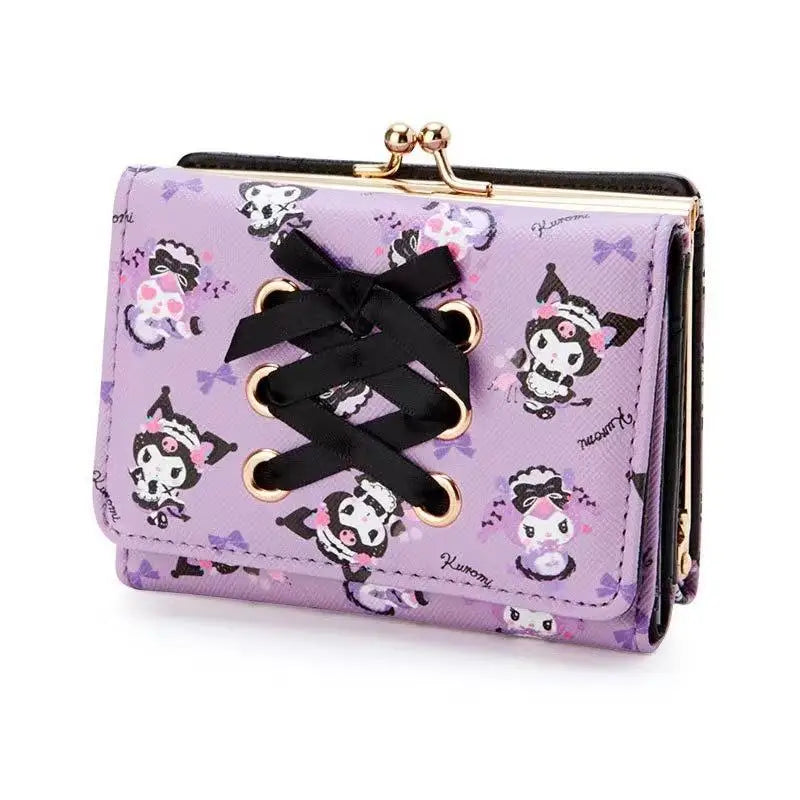Purple wallet with black lace detail and cartoon character pattern on a white background