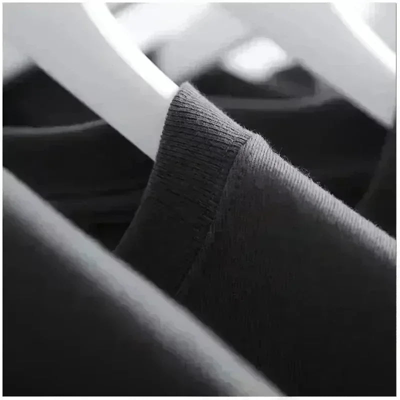 Close-up of a dark gray fabric texture on a blurred background