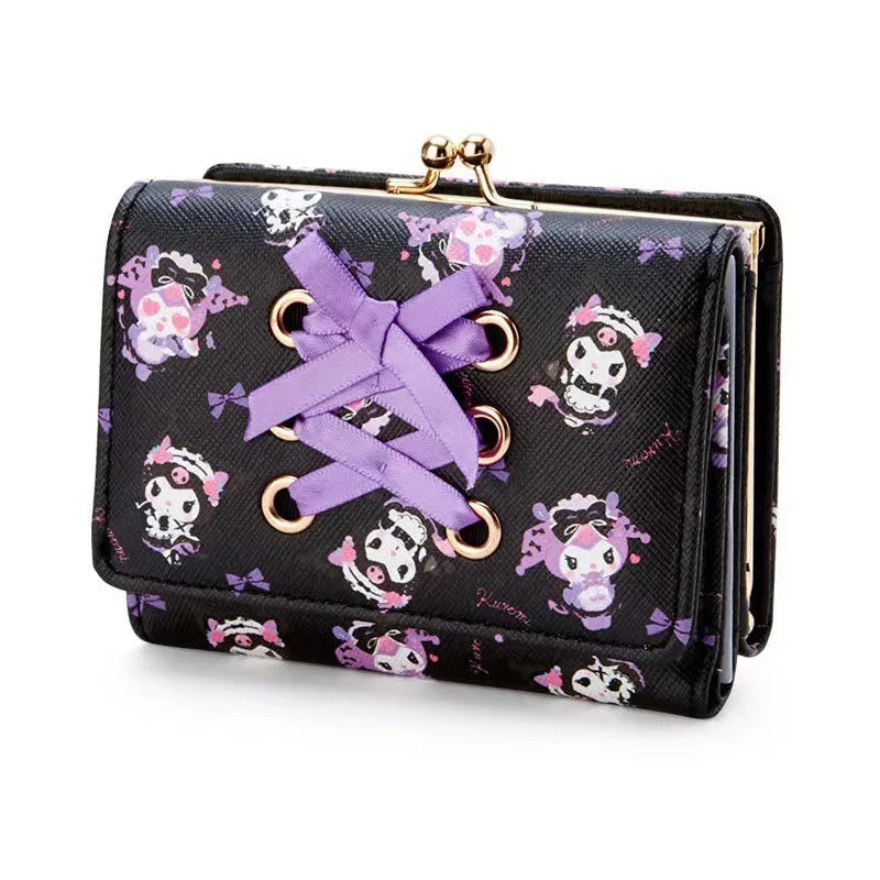 Black wallet with skull and bow pattern and purple ribbon on a white background