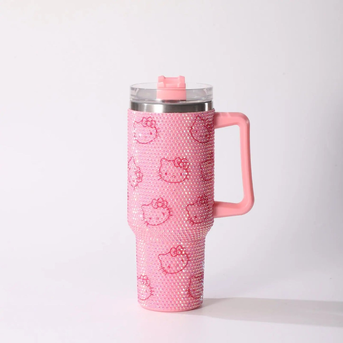 Pink tumbler with Hello Kitty design on a white background