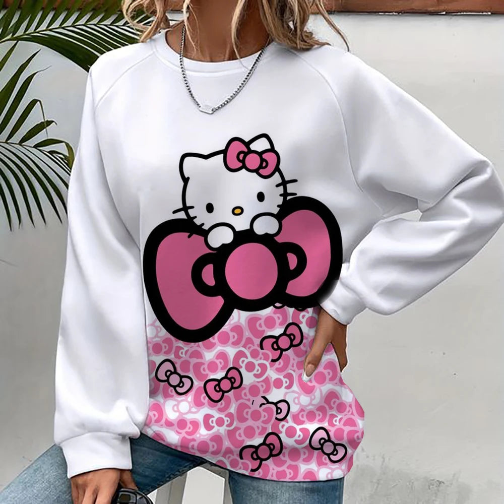 White sweatshirt with Hello Kitty design featuring a pink bow and pattern.