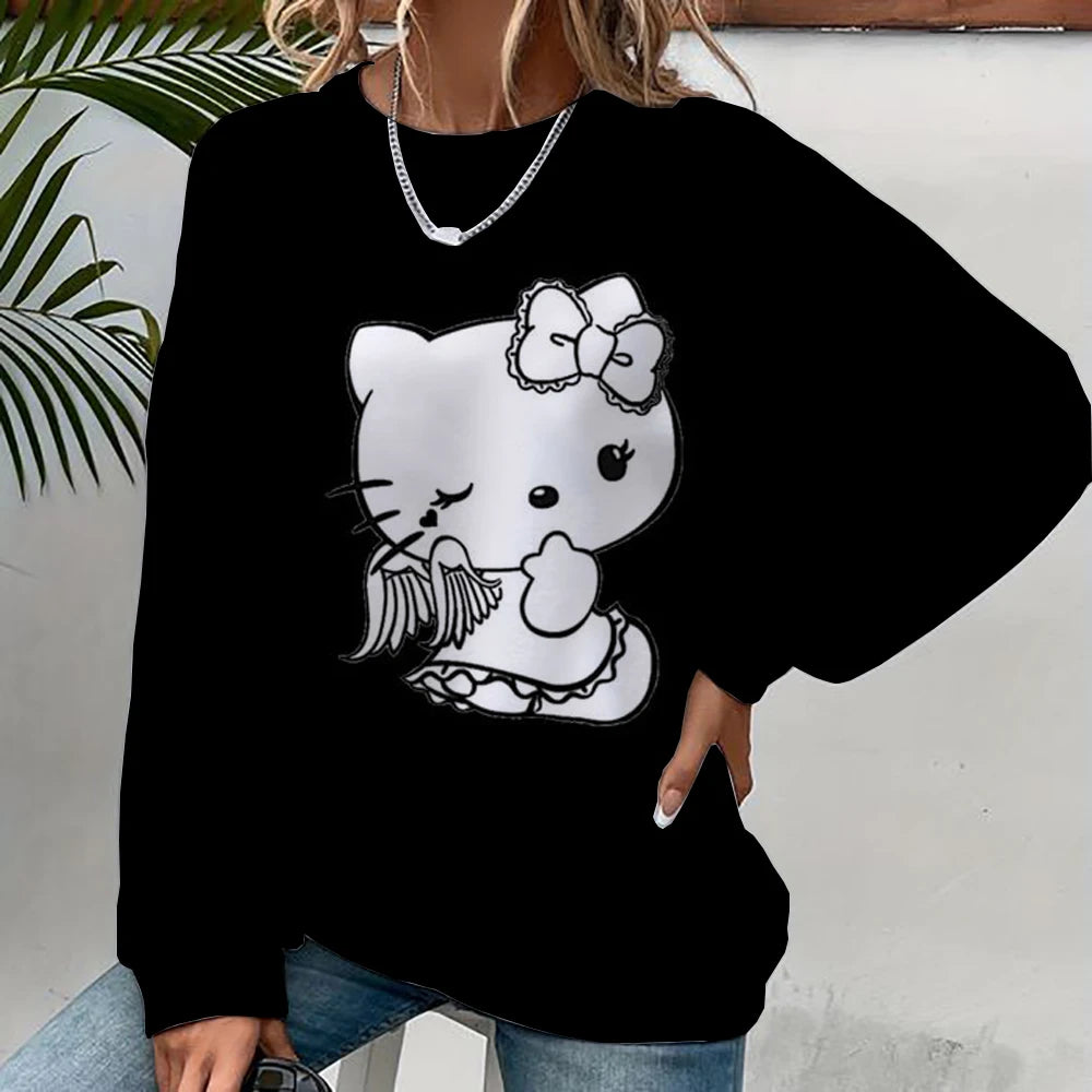 Black sweatshirt with a white cat design featuring a bow and angel wings, worn by a person.