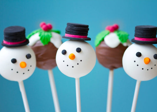 Handmade Christmas snowman cake pops with white chocolate coating and festive decorations