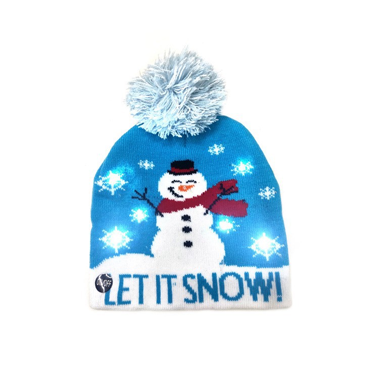 Bonnet de Noël tricoté avec boule de fourrure