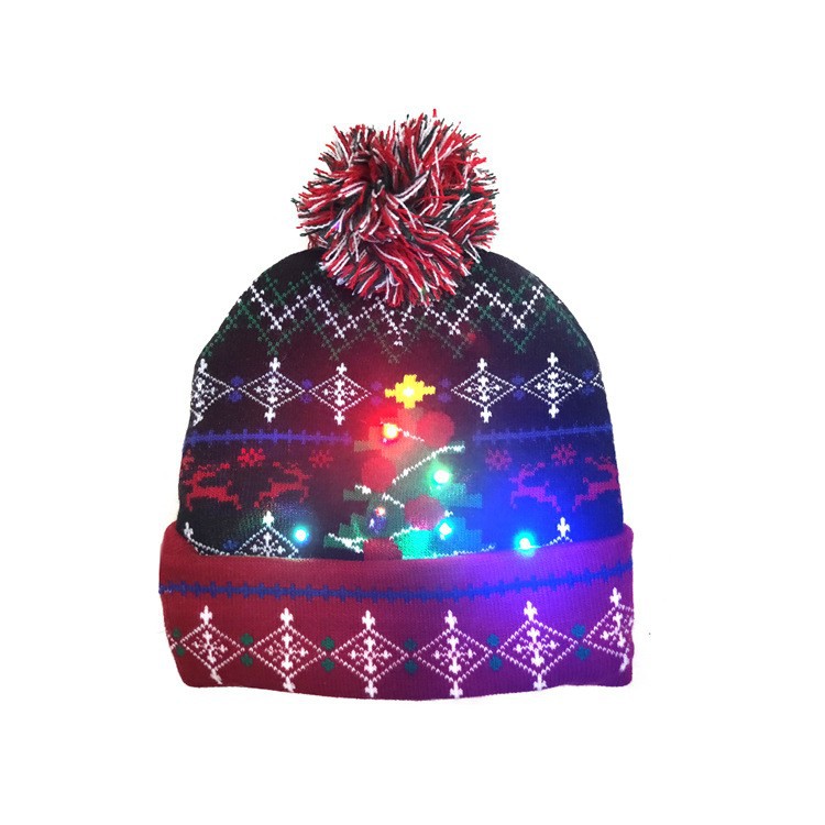 Bonnet de Noël tricoté avec boule de fourrure