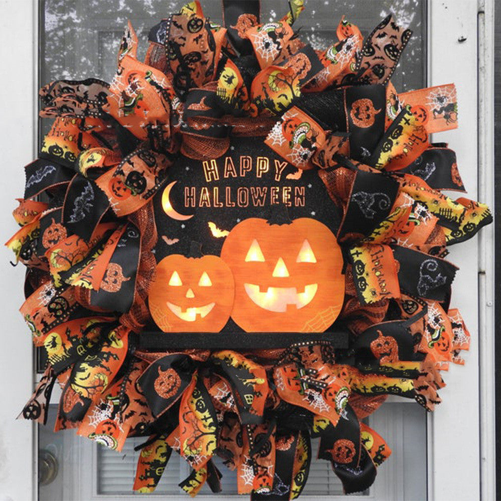 Couronne de citrouilles d'Halloween avec chat noir