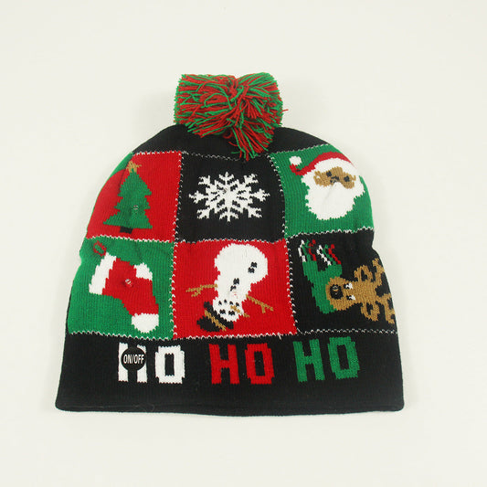 Bonnet de Noël tricoté avec boule de fourrure