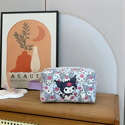 Cosmetic bag with cartoon design on a wooden surface with a framed picture in the background