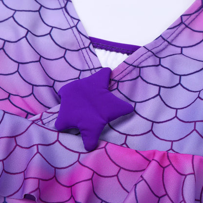 Close-up of a purple and pink swimsuit with star design on a white background