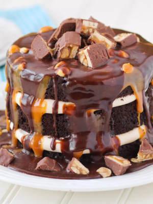 Chocolate Snickers Fudge Layer Cake
