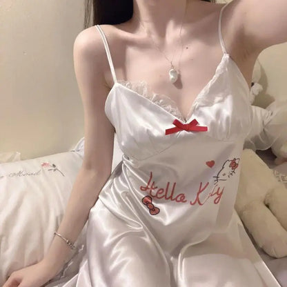 White satin dress with 'Hello Kitty' embroidery on a soft background