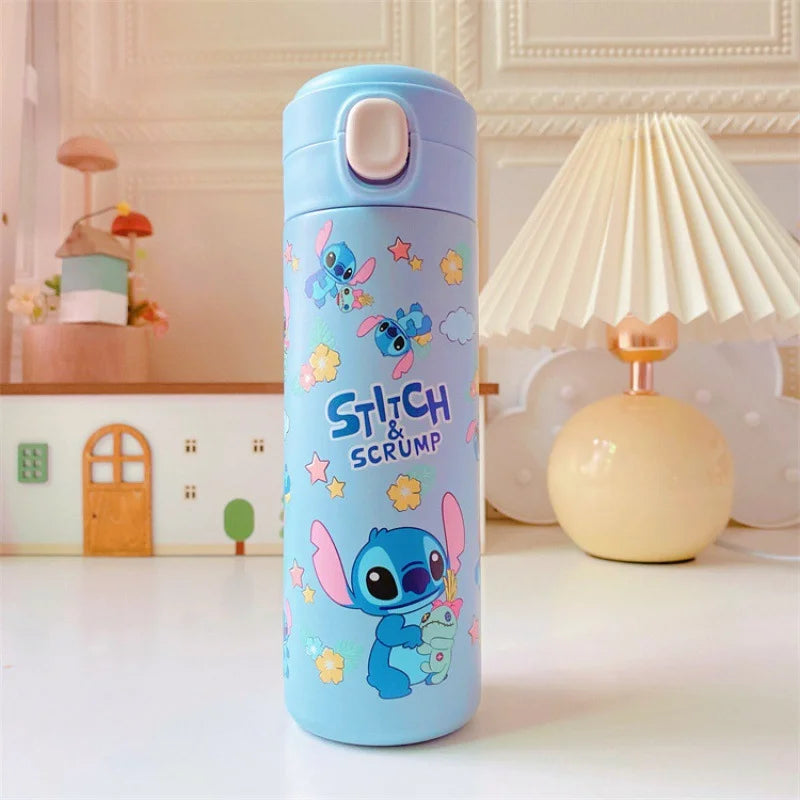Blue water bottle with cartoon character design on a table