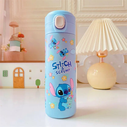 Blue water bottle with cartoon character design on a table