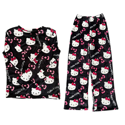 Hello Kitty pajama set with black background, white cat faces, and pink bows on a white background.