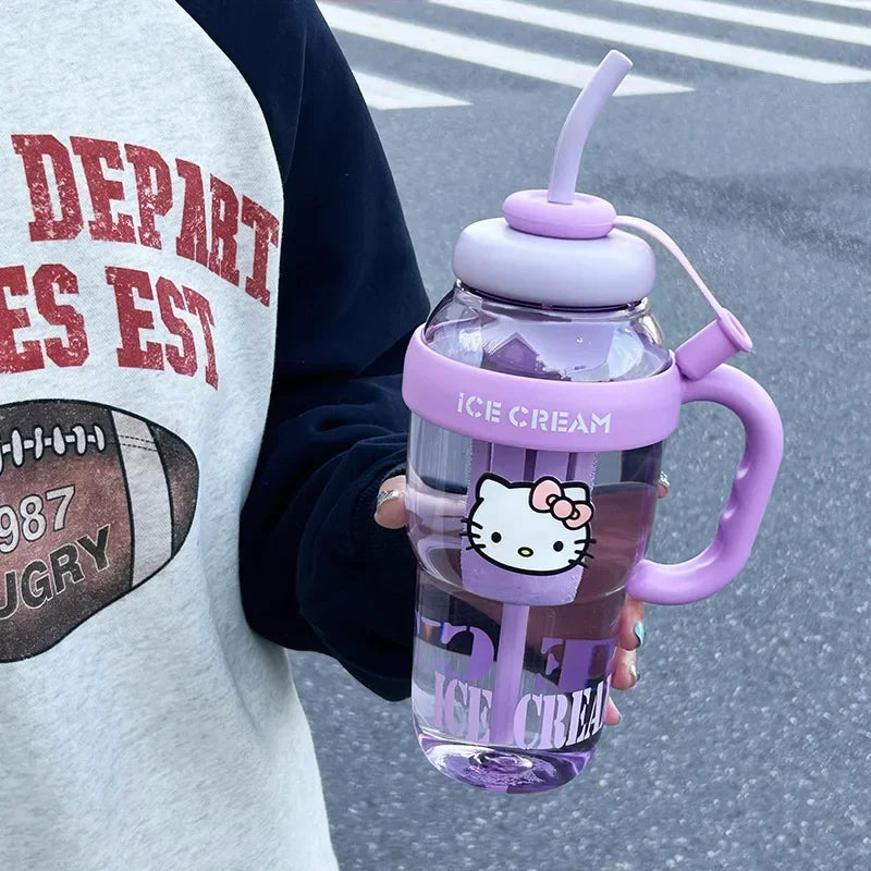 Person holding a purple ice cream-themed water bottle with a cartoon character on a street.