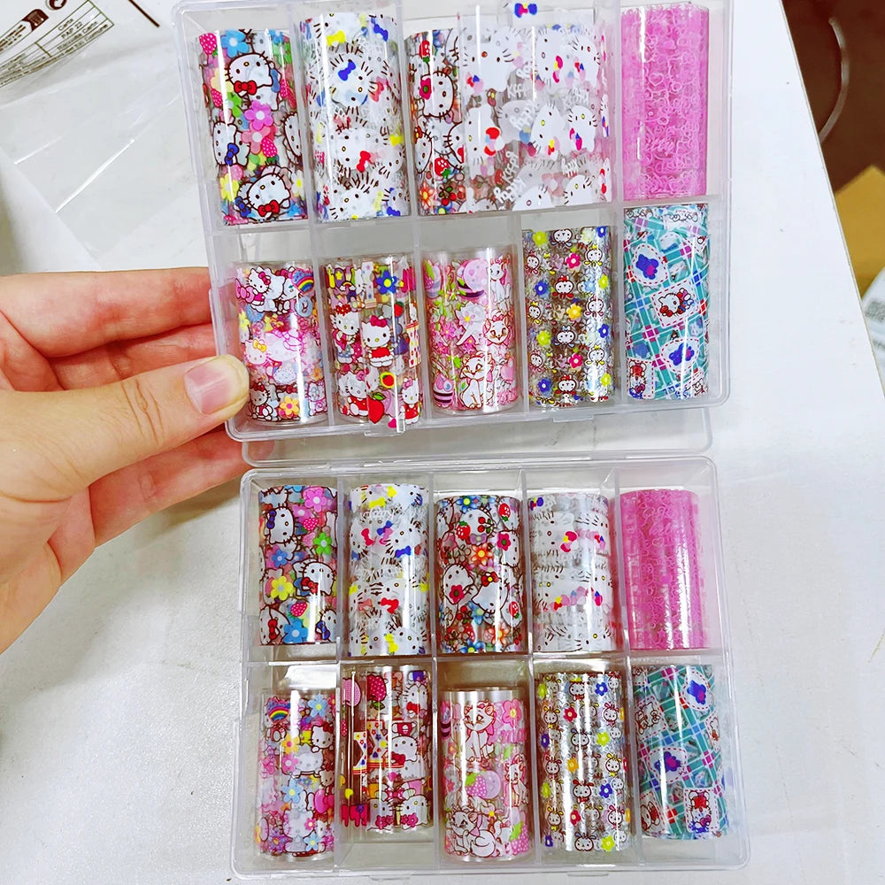 Set of colorful nail art designs in a clear organizer held by a hand.