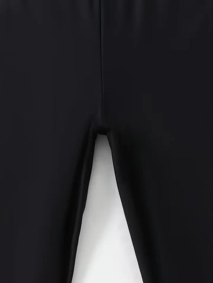 Close-up of a black fabric with a white seam on a dark background
