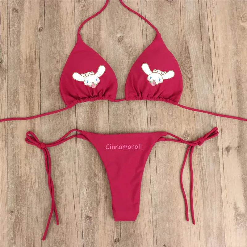 Red bikini set with cartoon character design on a wooden surface