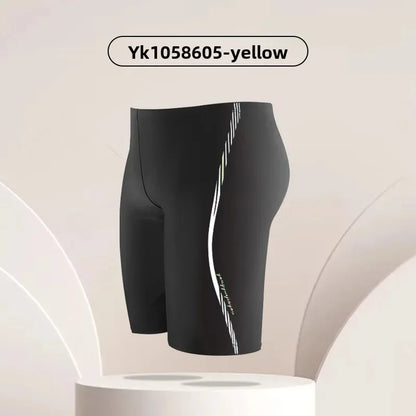 Black swim shorts with a white stripe on a beige background