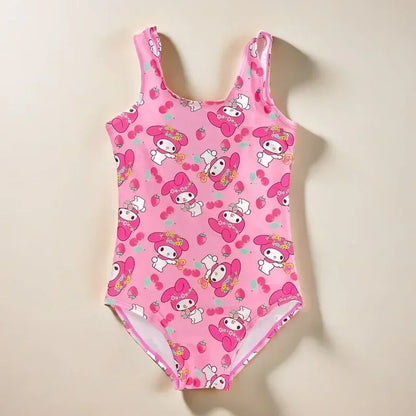 Pink children's swimsuit with cartoon character pattern on a beige background