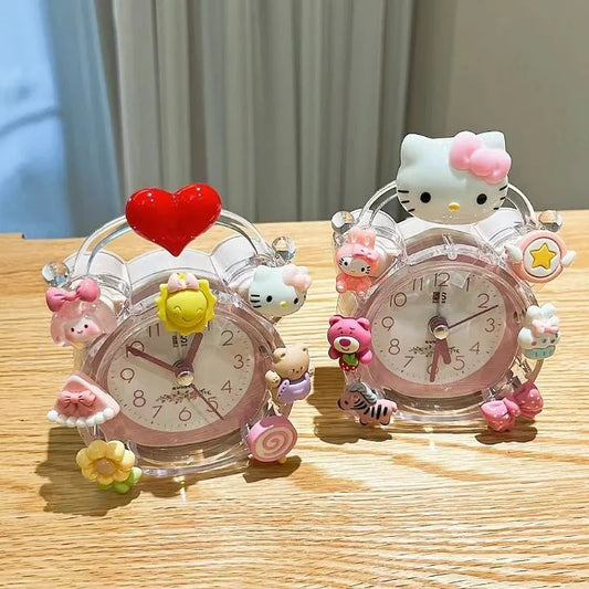 Two decorative clocks with cartoon character designs on a wooden surface.