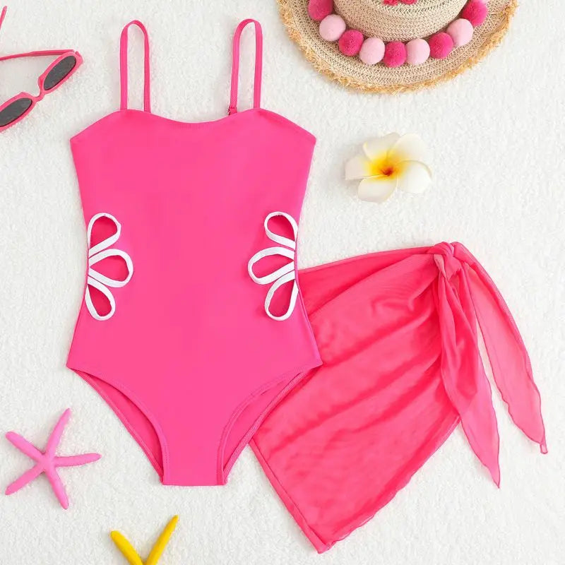 Pink swimsuit with floral designs on a white background