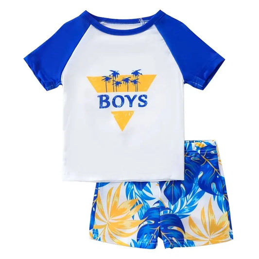 Children's beach outfit with a blue and white shirt and floral shorts on a white background
