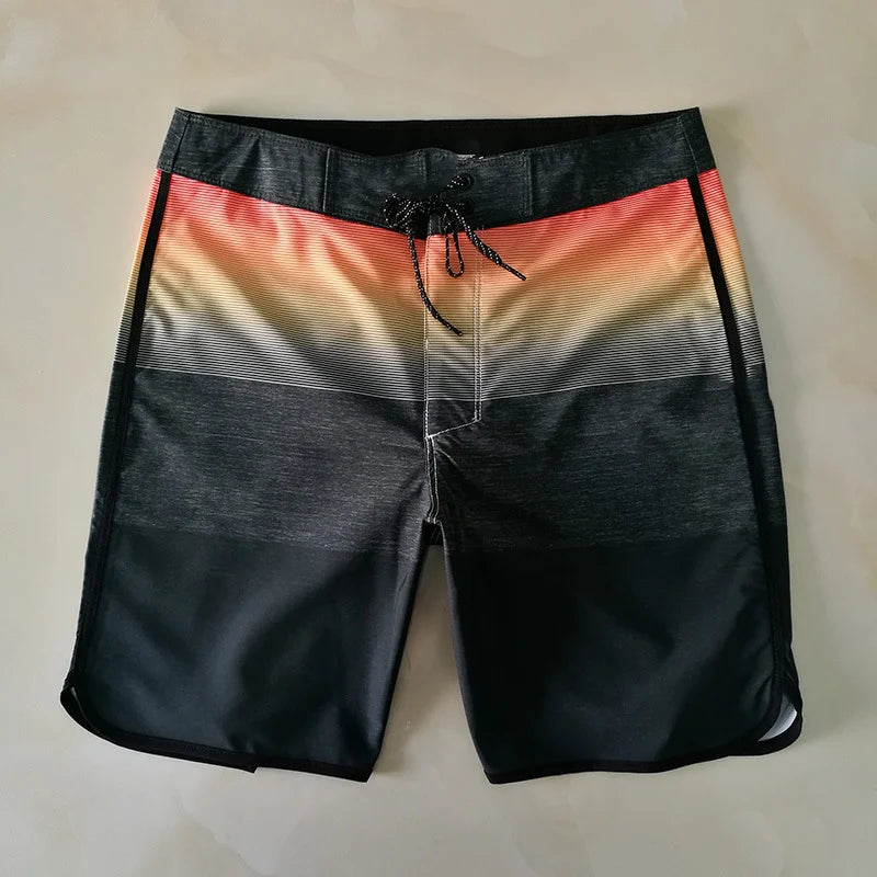 Black and multicolored striped shorts on a beige background