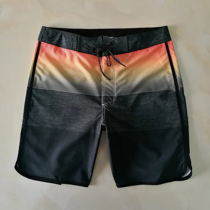 Black and multicolored striped shorts on a beige background