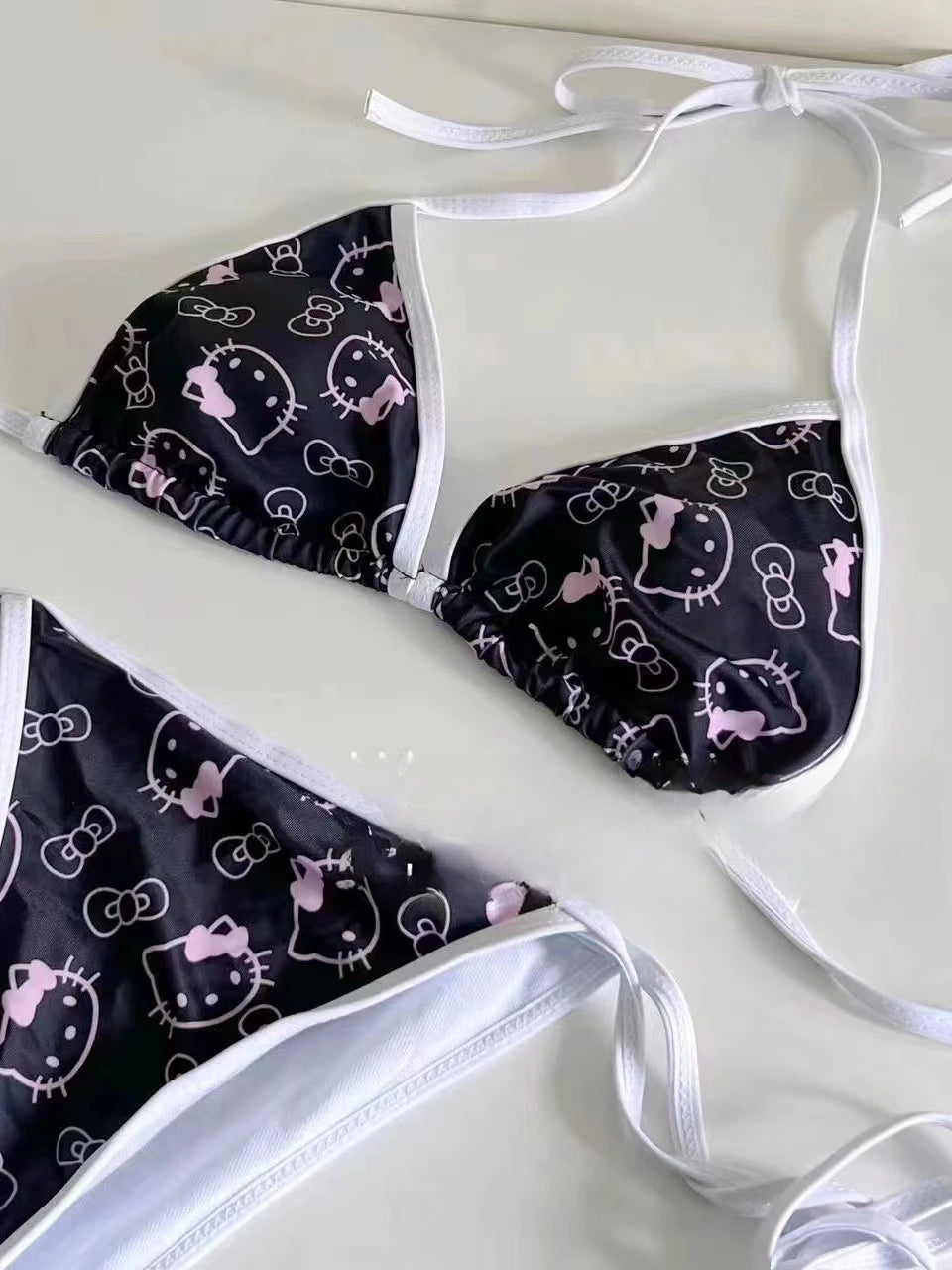 Bib with Hello Kitty pattern on a white background