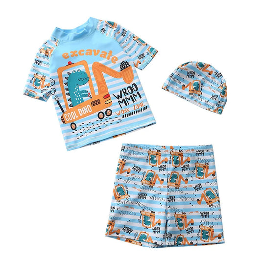 Children's outfit set with t-shirt, shorts, and hat featuring dinosaur and truck designs on a white background.