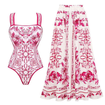 Floral swimsuit and skirt set with pink and red patterns on a white background