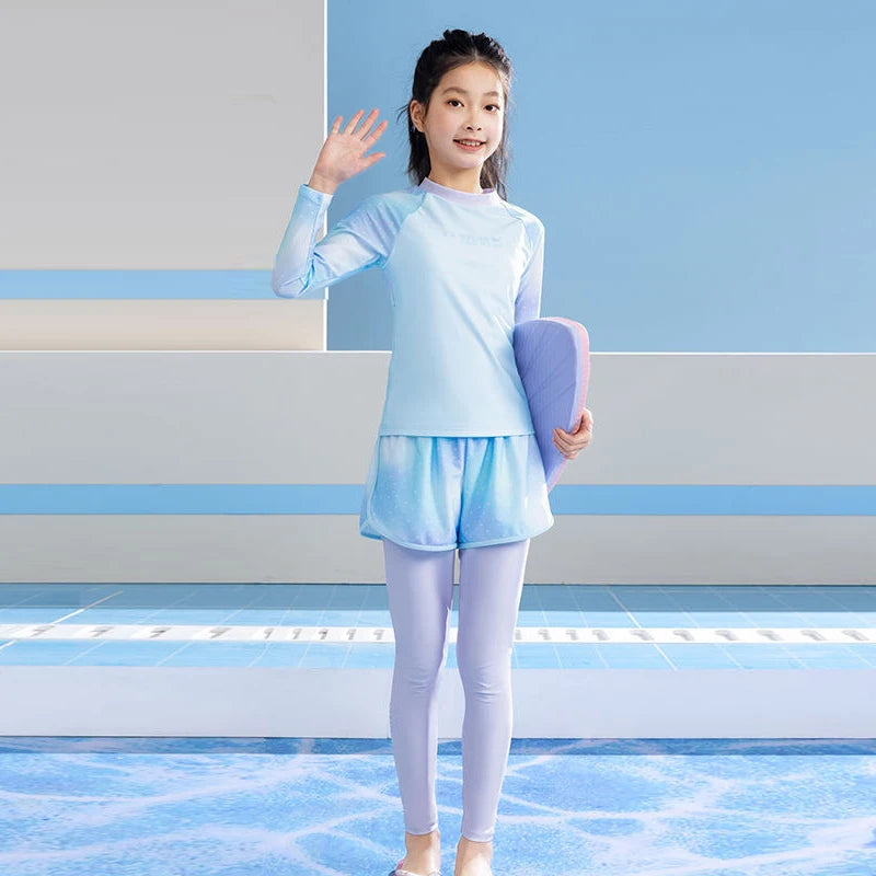 Young girl in light blue athletic wear holding a pink yoga mat on a striped background