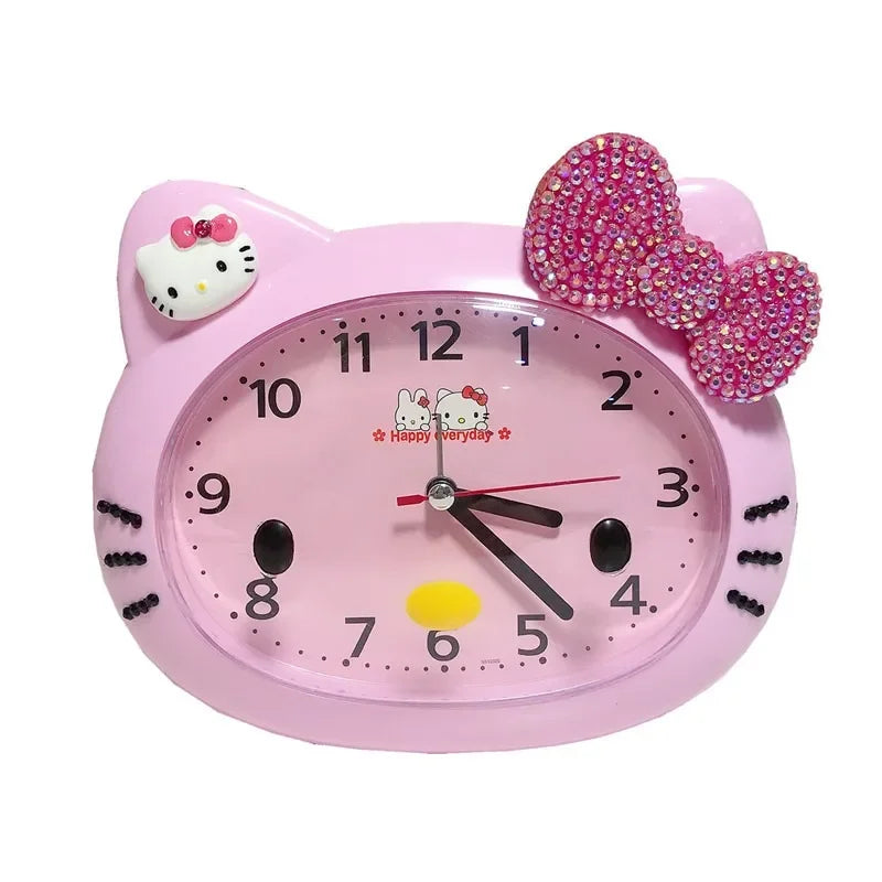 Pink Hello Kitty clock with a bow on a white background