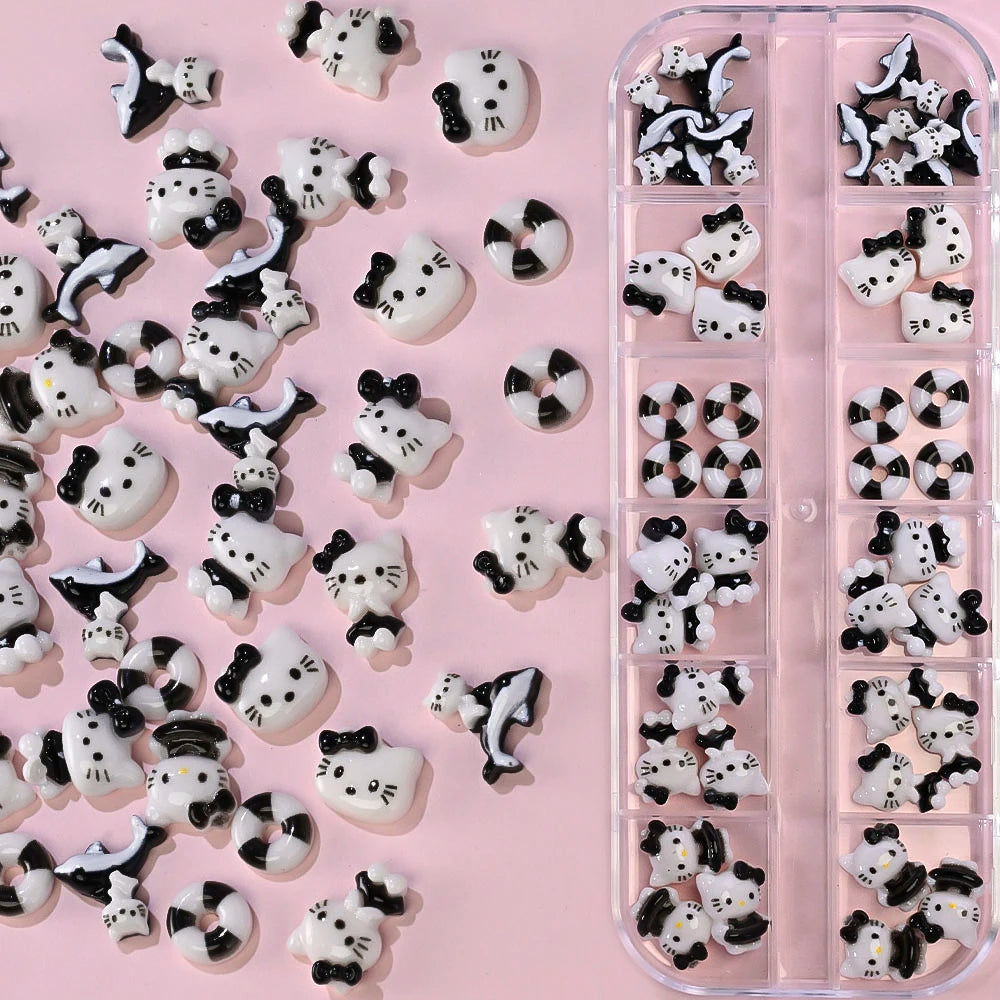 Decorative cat-shaped candies with black bows in a pink container on a pink background