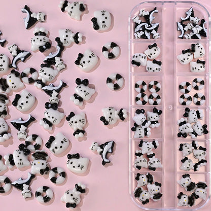 Decorative cat-shaped candies with black bows in a pink container on a pink background