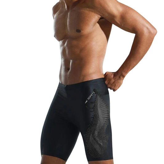 Man wearing black swim shorts with a brand logo on a white background