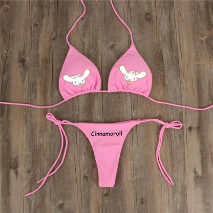 Pink bikini set with Cinnamoroll design on a wooden background