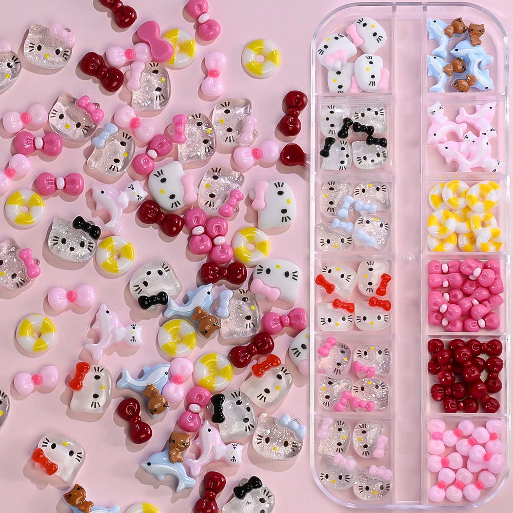 Collection of Hello Kitty-themed nail art decorations on a pink background
