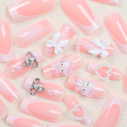 Pink nail art with decorative elements on a beige background