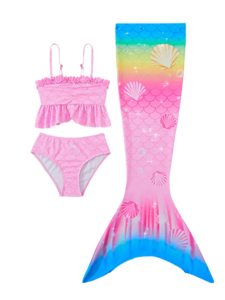 Pink mermaid tail swimsuit with shell design on a white background