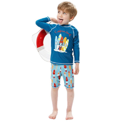 Child wearing a blue rash guard and patterned shorts with a life buoy in the background