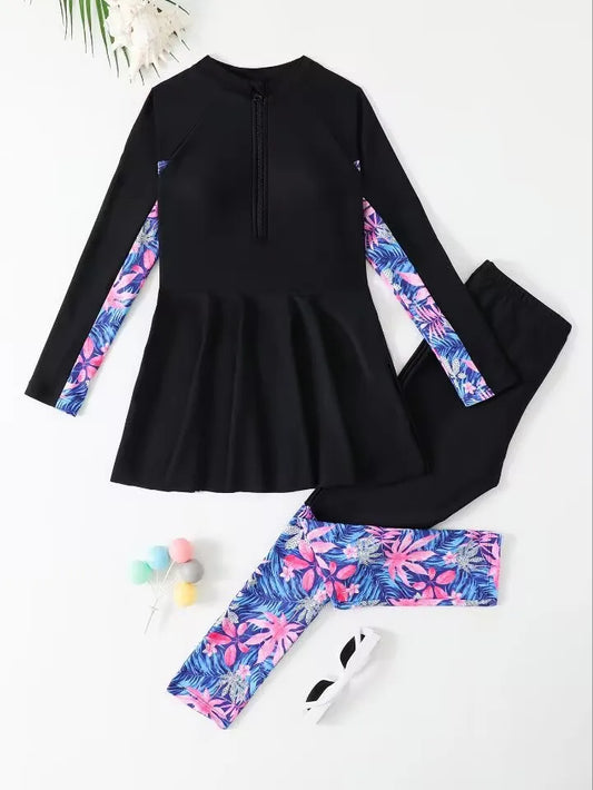 Black top and floral leggings set on a white background